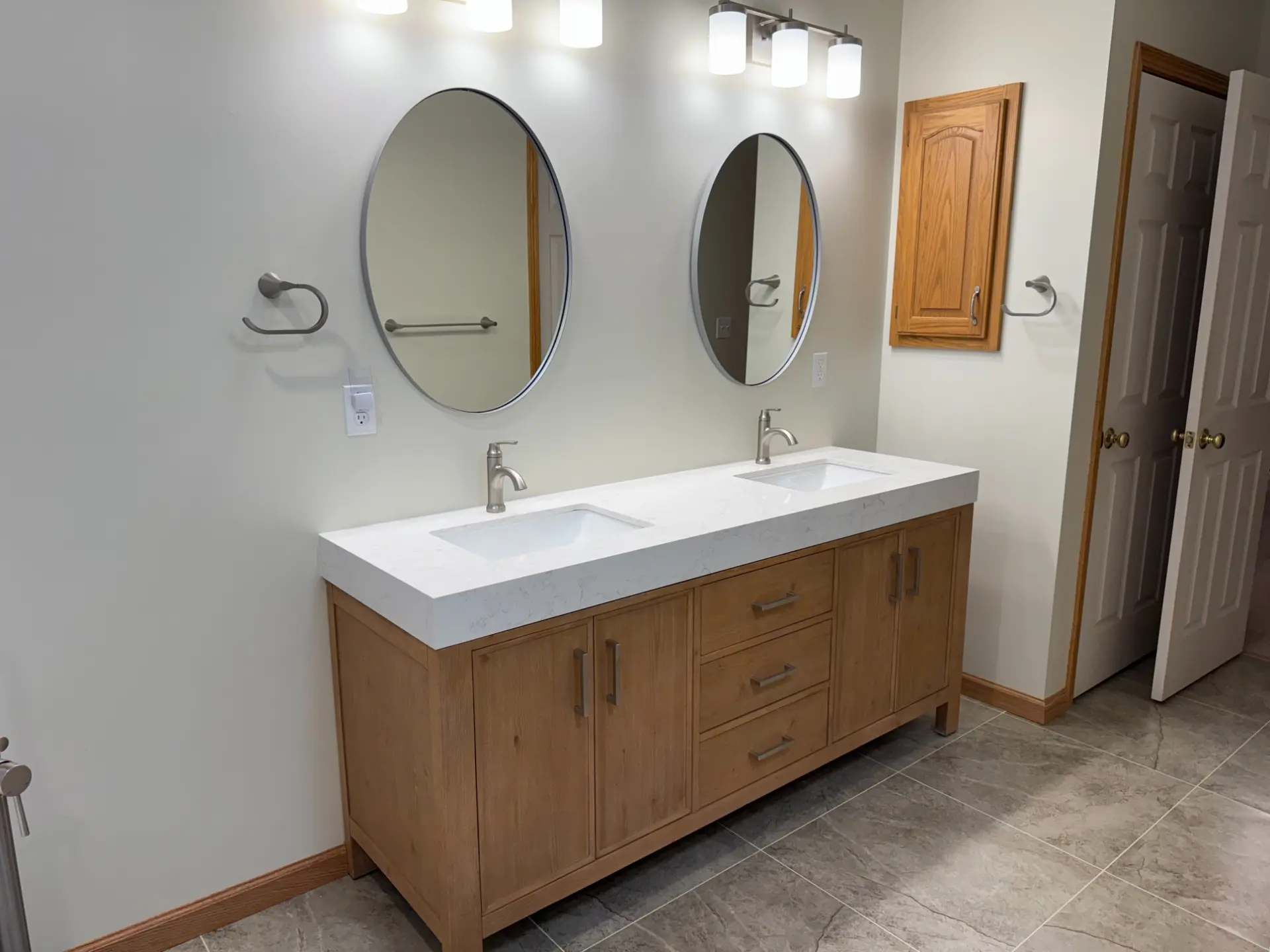 Modern bathroom double vanity remodeling by Serge Construction